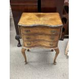 A small walnut veneered 3 draw drop sided chest.