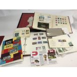 A collection of stamps, an album of Elizabeth II s