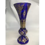 A large Bohemia blue glass vase with applied gilt.