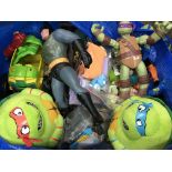 A bag of various toys including a Batman figure, T