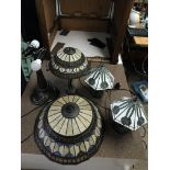 Four Tiffany style lamps, two pairs of matching de
