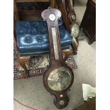 An antique mahogany mercury filled barometer.