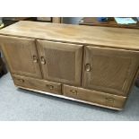 A Ercol sideboard with three doors and two drawers