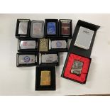 A collection of boxed Zippo lighters and buckles i