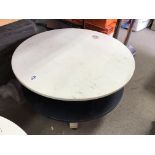 A pair of retro circular tables. Both Measuring in