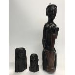 A large tribal heavy fertility carved wooden figur