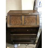 A dark oak bureau, approximately 105cm in height a