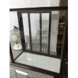 A table top mahogany display cabinet with sliding