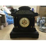 A black slate 8 day mantle clock.