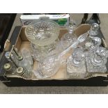 A box of glass decanters, cruets and bowls.