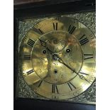 A 8 day long case clock the brass dial with Roman