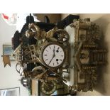 An 8 day heavy gilt and onyx figural mantle clock,