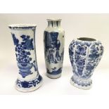 Three blue and white vases in various shaped and p