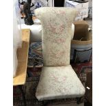 A shaped tall backed Victorian chair.