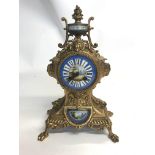 A french gilt spelter clock with pendulum inset wi