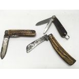 Three antique horn and wood Handled folding knives