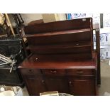 A varnished 60s design oak cabinet in an Ercol sty