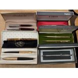 A vintage cased Parker 51 fountain pen set, togeth