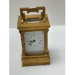 A small gilt brass 4 glass carriage clock.