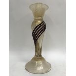 A single Venetian style candlestick together with