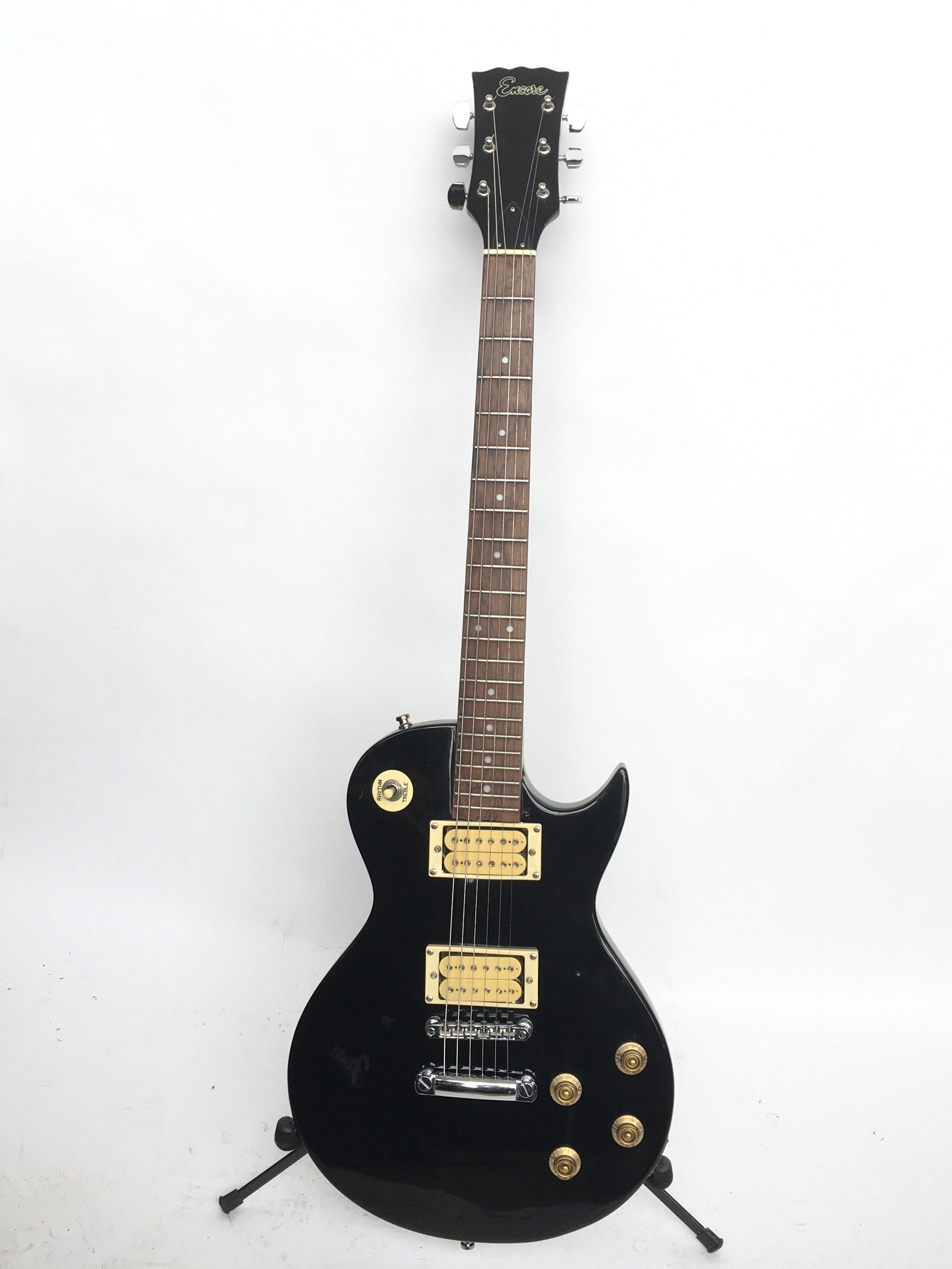 An Encore Les Paul style electric guitar in black.