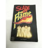 A fully signed 'Slade In Flame' paperback book.