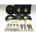 Two Beatles EPs and six 7inch singles.