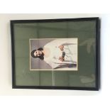 A framed and glazed signed colour print of Carrie