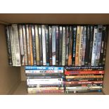 A collection of over 100 music DVDs of various art