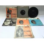 Four Buddy Holly EPs and three 7inch singles.