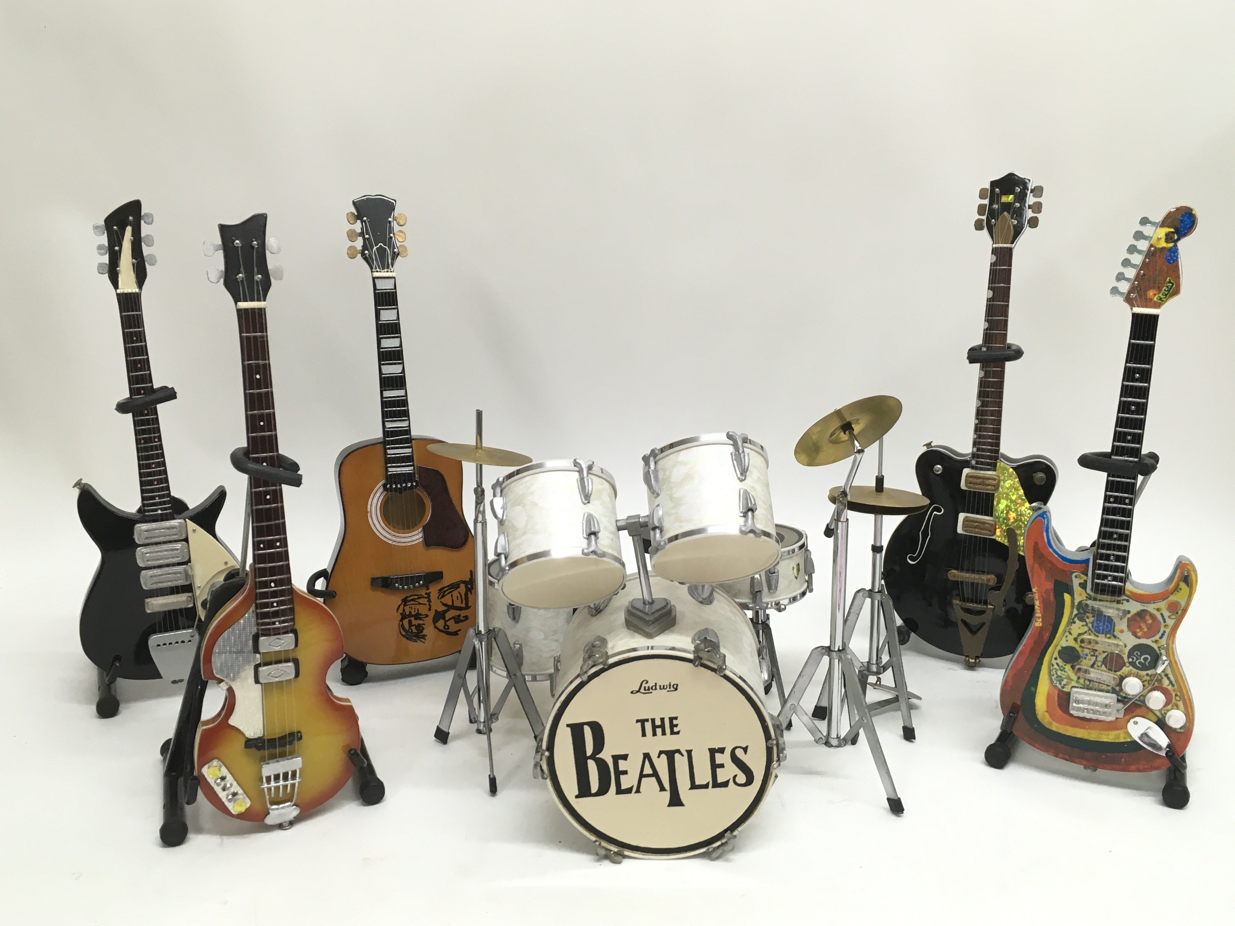 A collection of miniature iconic Beatles instrumen