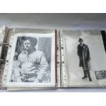 Two binders of old movie publicity prints.