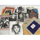 A box of music and film memorabilia including post