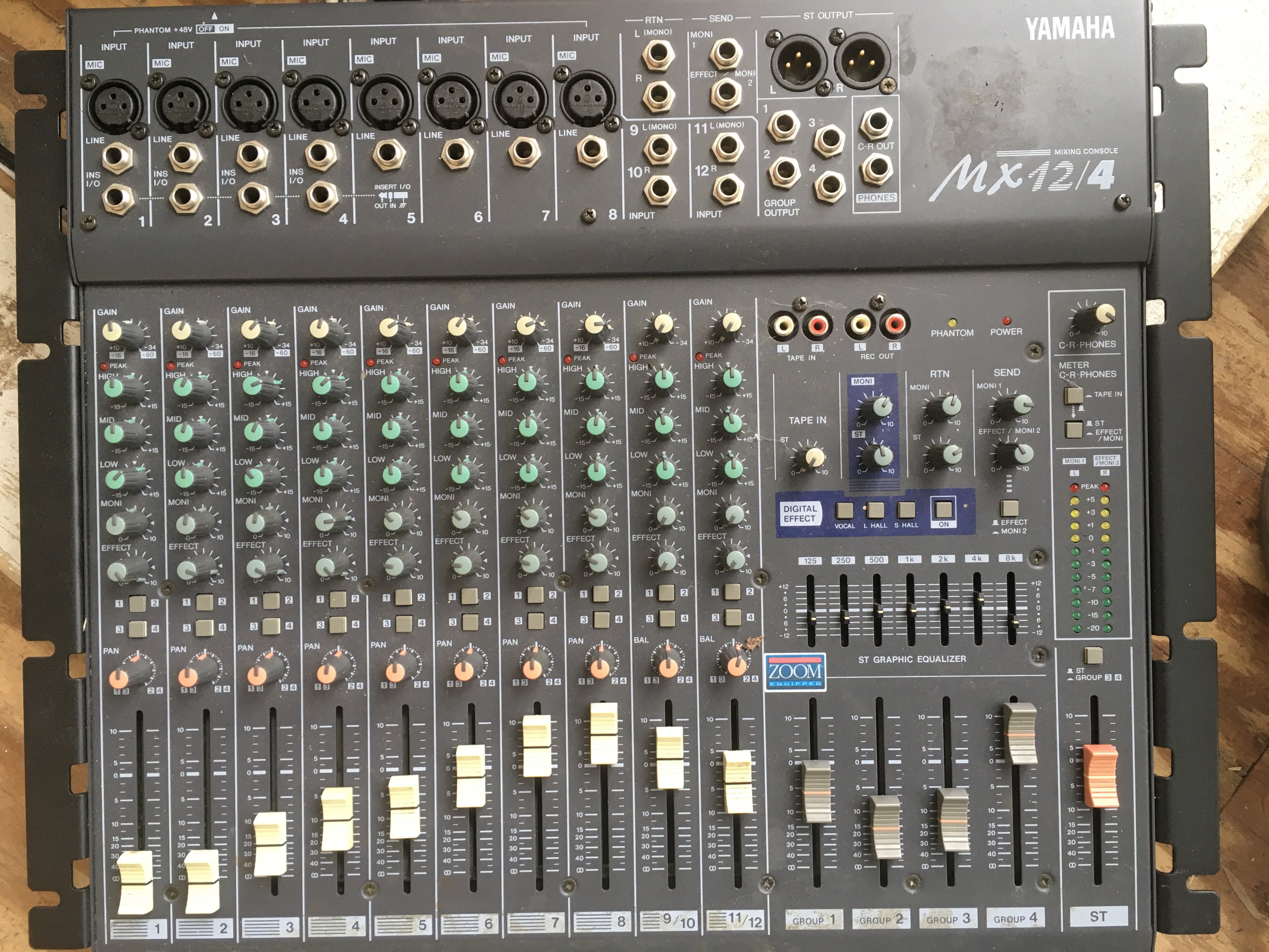 A Yamaha MX12/4 mixing console with instructions.