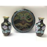 A pair of cloisonné vases and a cloisonné bowl.