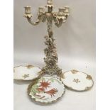 A German candelabra decorated with cherubs flowers