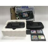 Two Sega game gear hand held consoles, one boxed,
