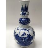 A Chinese mid 19th century, possibly earlier, blue and white export vase in a double gourd shape.