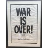A framed John Lennon And Yoko Ono 'War Is Over' Pr