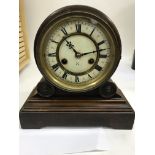 A German mantle clock with Roman numerals and deco