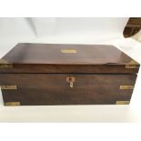 A large sloped walnut and brass bound writing box