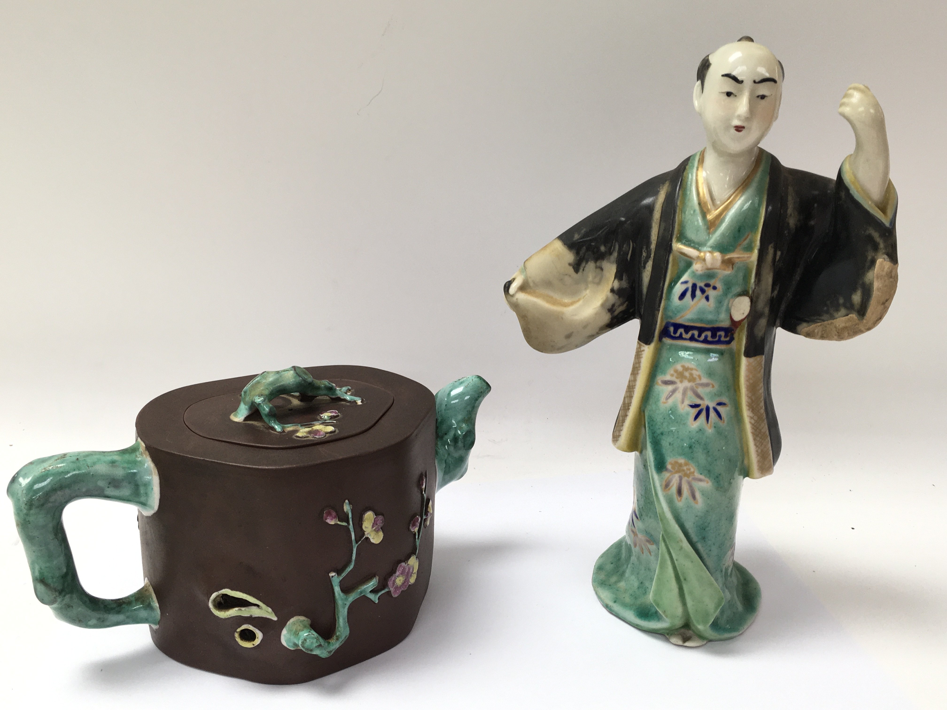 A Ji - Xing terracotta teapot, and a Chinese figur