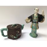 A Ji - Xing terracotta teapot, and a Chinese figur