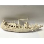 A carved ivory junk boat.