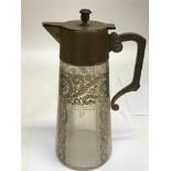 A glass and bronze Art Deco jug