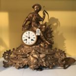 A Victorian gilt mantle clock with Roman numerals