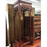 An oriental hardwood modern jardiniere stand with