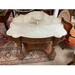 A Victorian marble topped washstand with baluster supports.