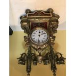 A Roman numeral mantel clock with French Victorian