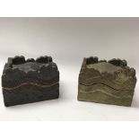 A pair of unusual lidded pottery boxes.